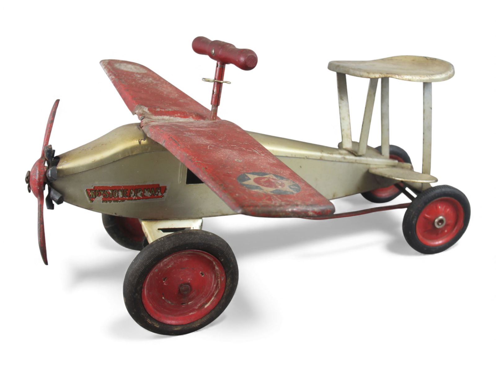 Keystone Pressed Steel Ride One Air Mail Plane: Keystone Air Mail pressed steel ride-on airplane with original partial Keystone Air Mail decals on the fuselage and partial U.S. roundel insignias on both wings. Features a front propeller, ride-on se