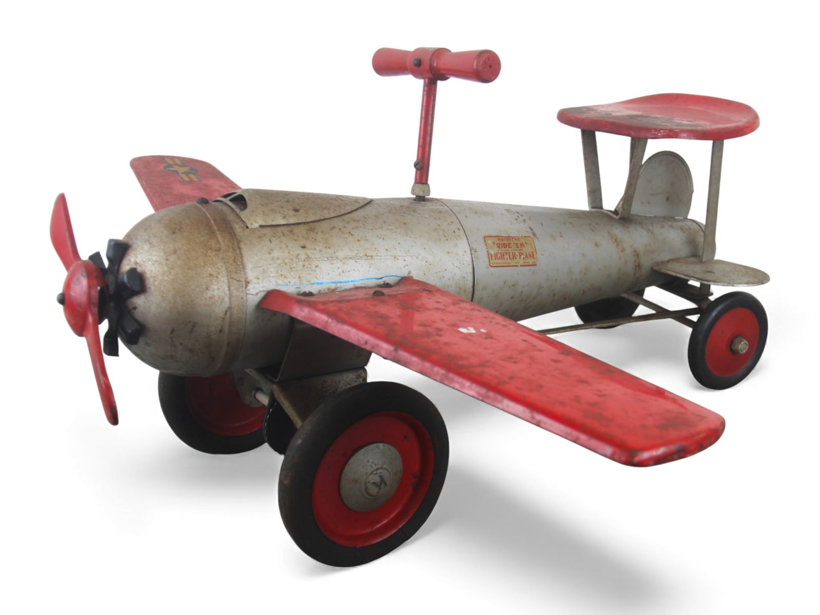 Keystone Pressed Steel Ride 'Em Fighter Plane: Keystone "Ride 'Em" Fighter Plane in silver and red paint with original decal on the fuselage and U.S. military-style insignia on one wing end. Features pressed steel construction, large red propeller