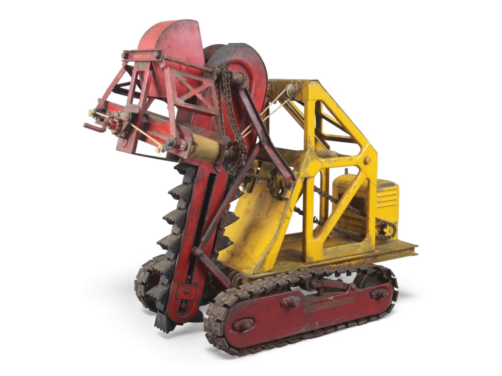Buddy L 400 Trench Digger on Tracks: Early pressed steel Buddy L "Trench Digger," circa 1928, featuring the classic red bucket conveyor assembly, yellow operator platform, and original tracked base with chain-driven trenching mechanism.