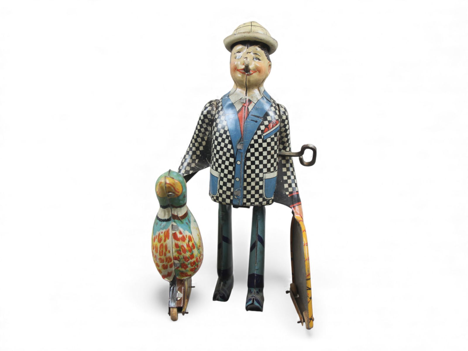 Marx Joe Penner and His Duck Toy: Marx tin lithographed "Joe Penner and His Duck" wind-up toy. Features moving legs and a hat that pops up and down. Stands approx. 8" tall. Working condition when tested. From the Charles Atchison Coll