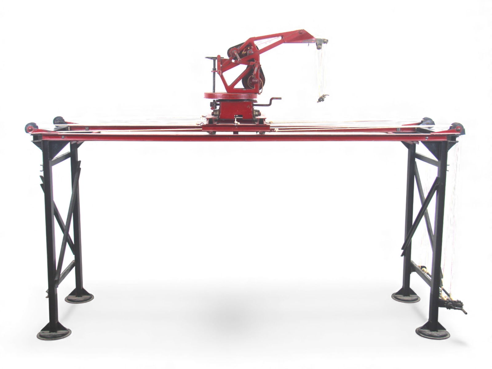 Buddy L Pressed Steel Overhead Traveling Crane: Large pressed steel Buddy L "Overhead Traveling Crane", circa 1928-30, Model #250-A. Features black tower legs, red traveling crane deck, hand-operated winch, pulley system, sliding carriage, and swiv