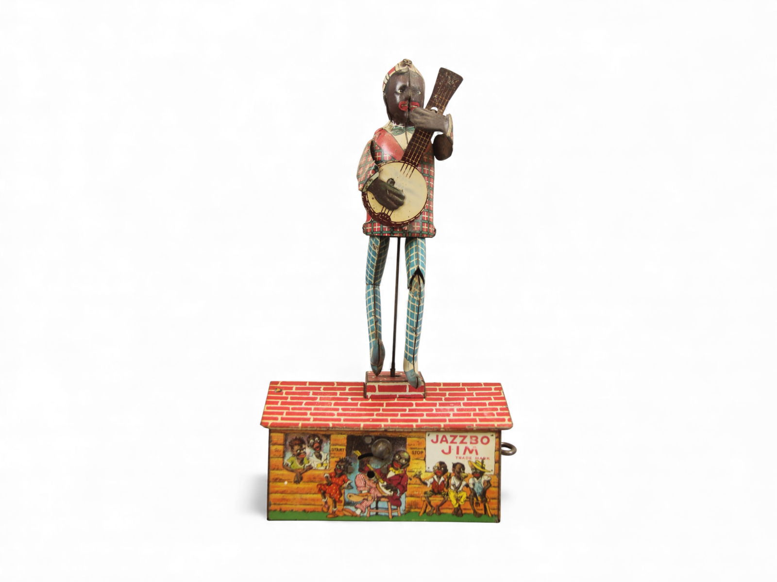 Strauss Jazzbo Jim Wind-Up Toy: Strauss tin lithographed "Jazzbo Jim" wind-up toy featuring a man playing a banjo and dancing on a rooftop. Stands approx. 10?" tall. Excellent example in perfect working order when tested. From the C