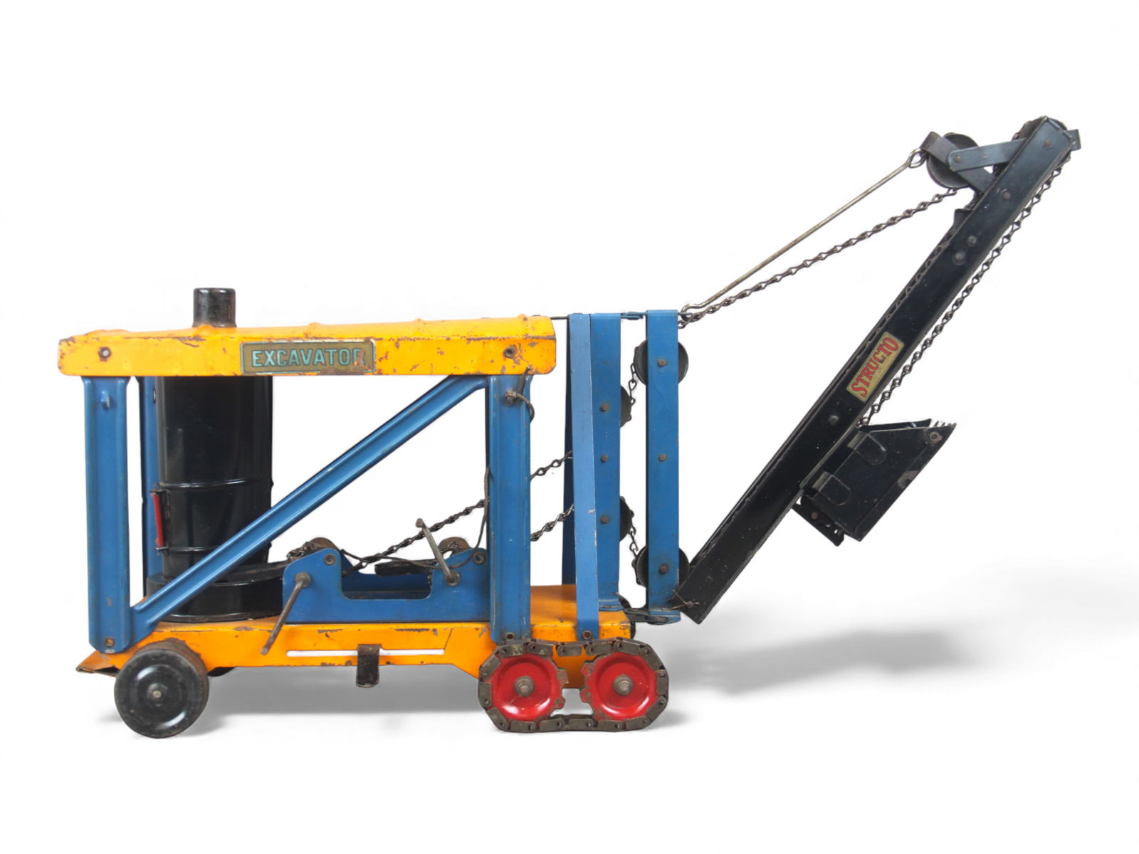 Rare Structo Pressed Steel Steam Excavator: 1920s painted pressed steel with boiler inside with opening coal hatch, 25" long. Has chain driven Elevator, Swing & Dig controls. Front wheels are tracked, swing control on side. It has nice decals,