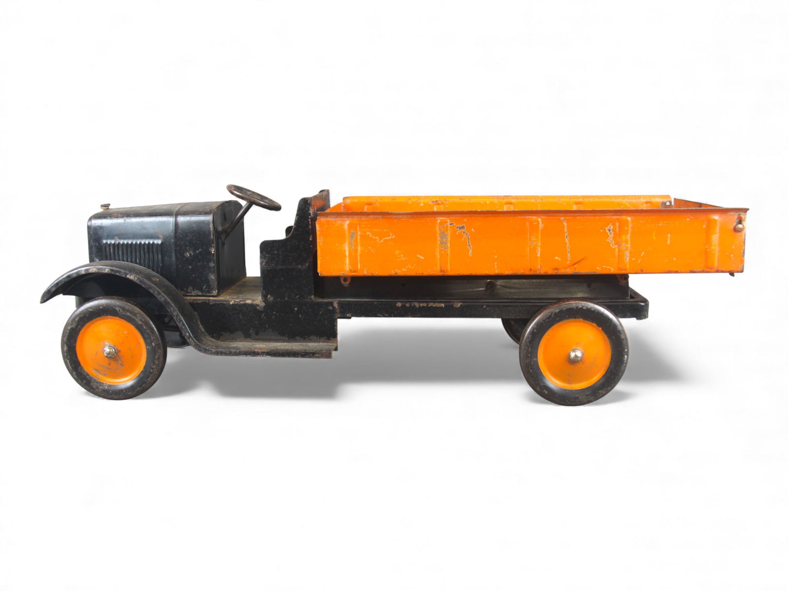 Dayton Son-ny Dump Truck: Painted pressed steel with metal wheels, 27" long. Mechanical dump bed with operating tailgate. It show moderate play wear with nice grill decal. Shipping: Weiss Auctions offers full-service, in-house