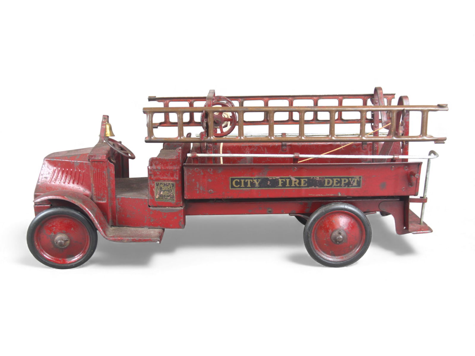 Steelcraft Mack City Fire Truck: Bulldog Mack with open cab design. It has its original crank-up center ladder, 2 auxiliary ladders, hose reel with rope and nozzle. Decals are 85%. It would benefit from a clean and polish, and