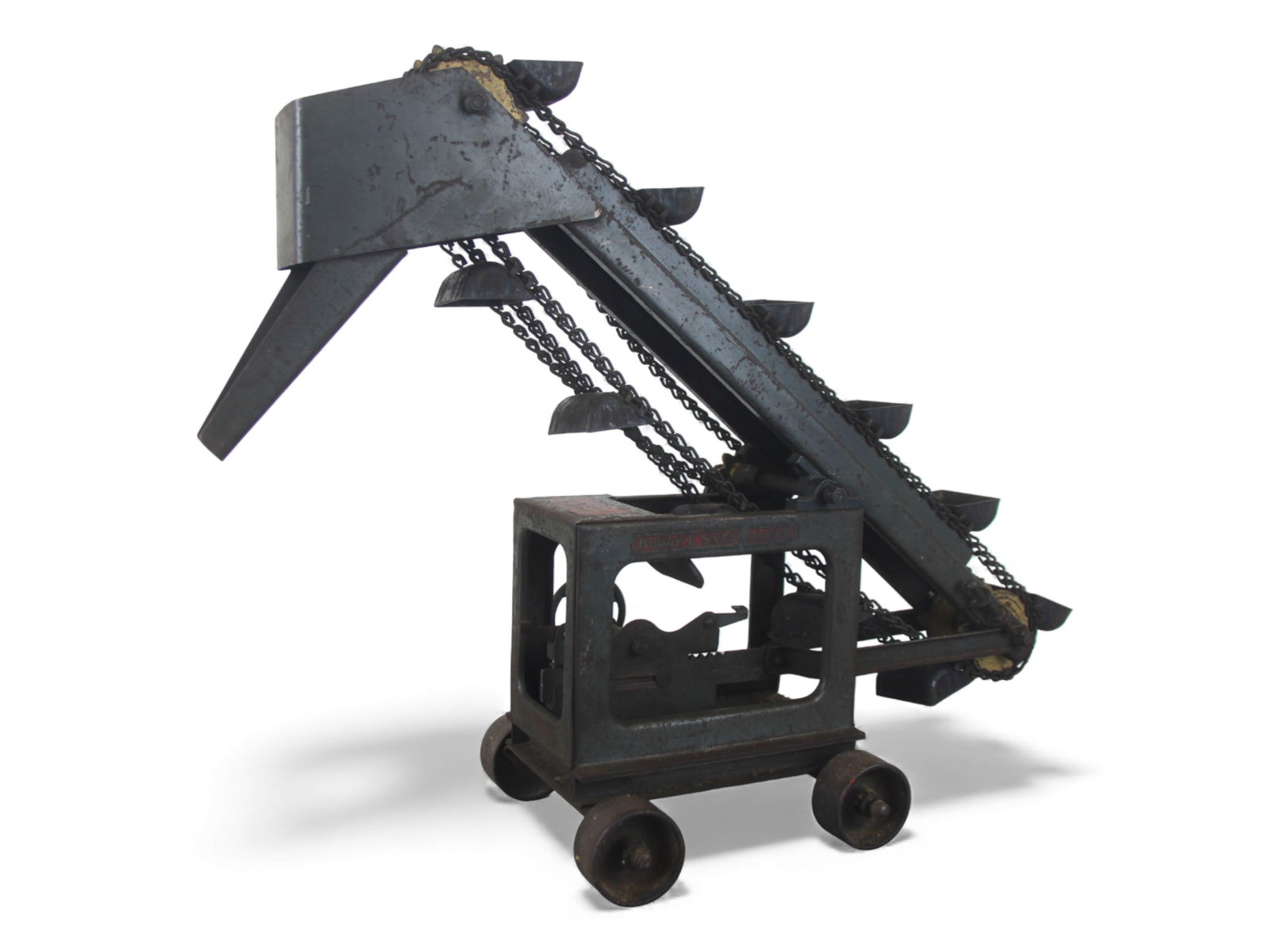 1930s Buddy L Sand Loader: Painted pressed steel, 18" tall. Has functional crank action scoop mechanism with tilt angle wheel. It would benefit from a good cleaning. It has better than average decals and shows moderate play