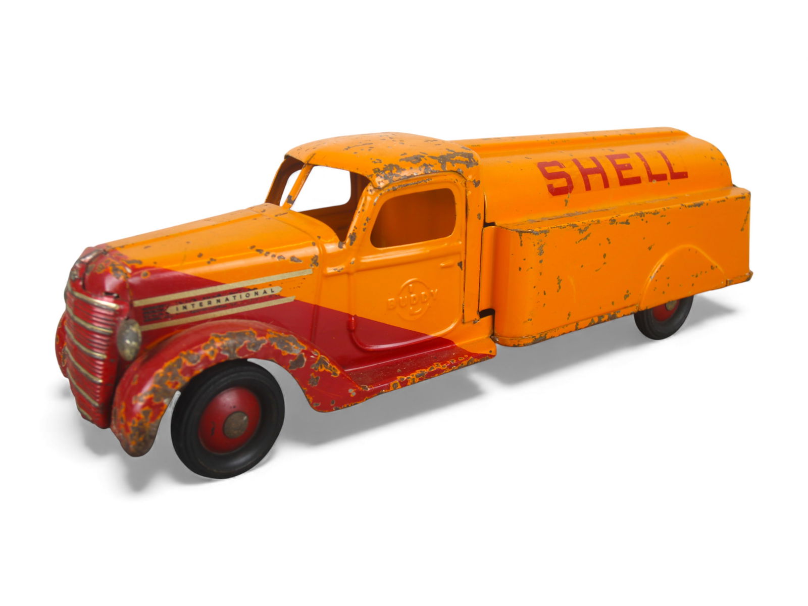 Buddy L Shell Gas Delivery Truck: 1940. Painted pressed steel with rubber wrapped steel hubs, 21" long. It has nice decals and is clean and shiny, showing moderate play wear. Shipping: Weiss Auctions offers full-service, in-house