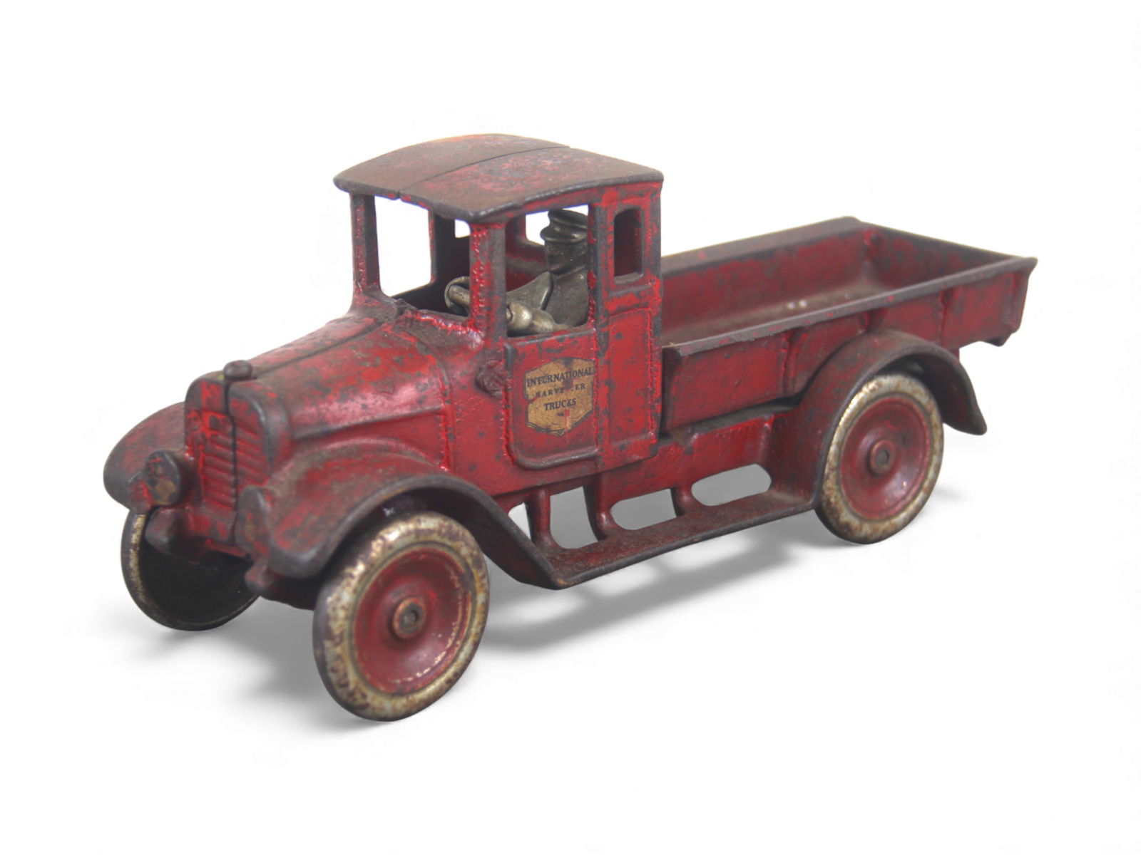 Hubley IH Red Baby Dump Truck: Painted cast Iron with metal wheels, 10" long. It has good decals and shows moderate to heavy play wear and would benefit from a clean and polish. Shipping: Weiss Auctions offers full-service, in-hous