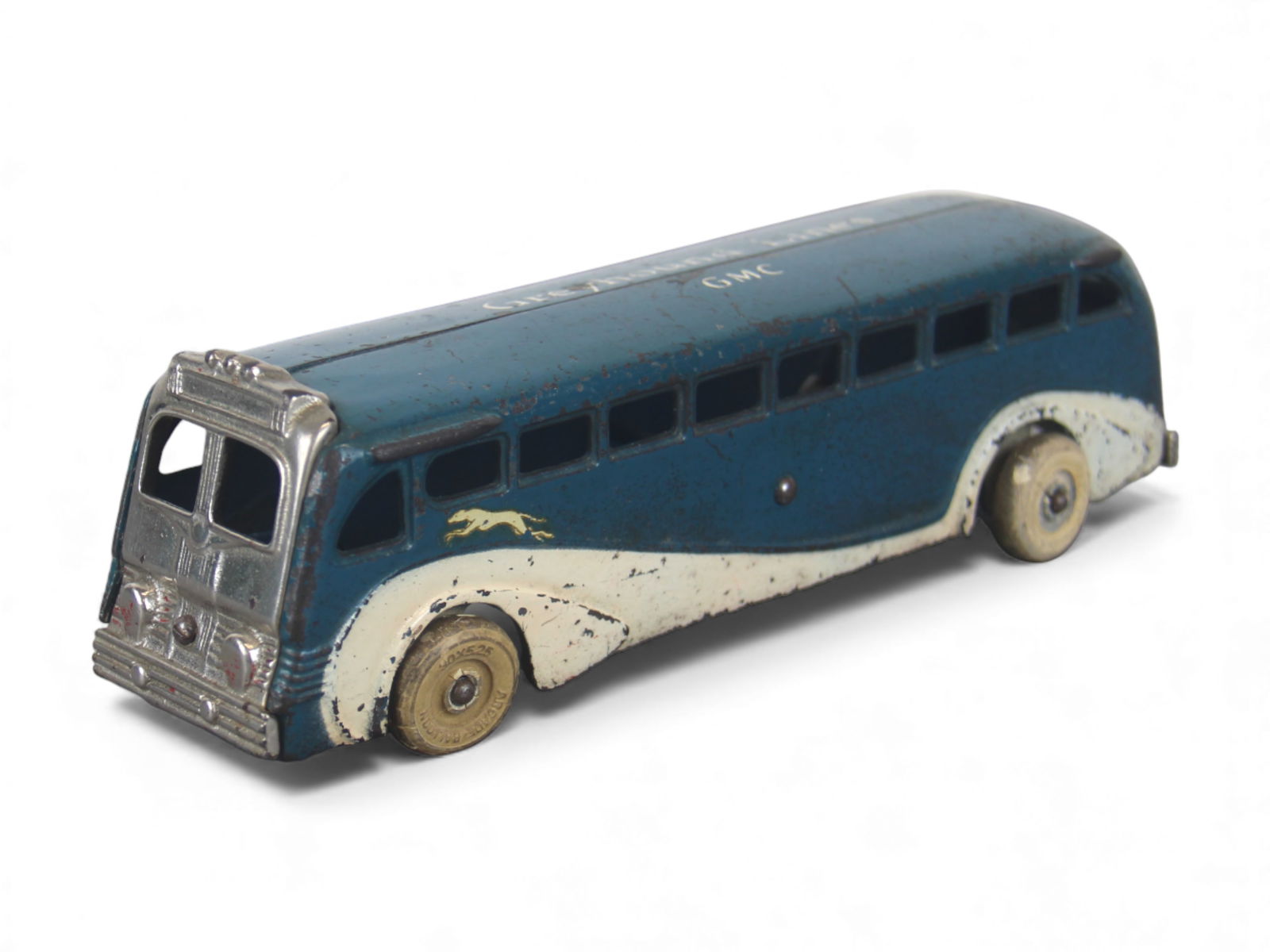 Nice Arcade GMC Greyhound Bus: Painted cast iron with WRT, and nickel parts, 9" long. It is clean and shiny, showing light play wear. Nice example. Shipping: Weiss Auctions offers full-service, in-house shipping for nearly all item