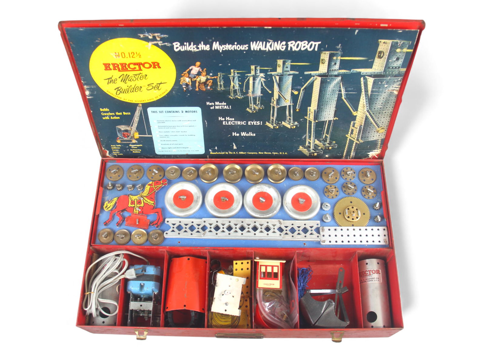 A.C. Gilbert Erector No. 12-1/2 Walking Robot Set: Vintage A.C. Gilbert Erector No. 12-1/2 "The Master Builder" set, dated 1956, housed in its original red metal case. The cardboard interior insert features bold graphics promoting "Builds the
