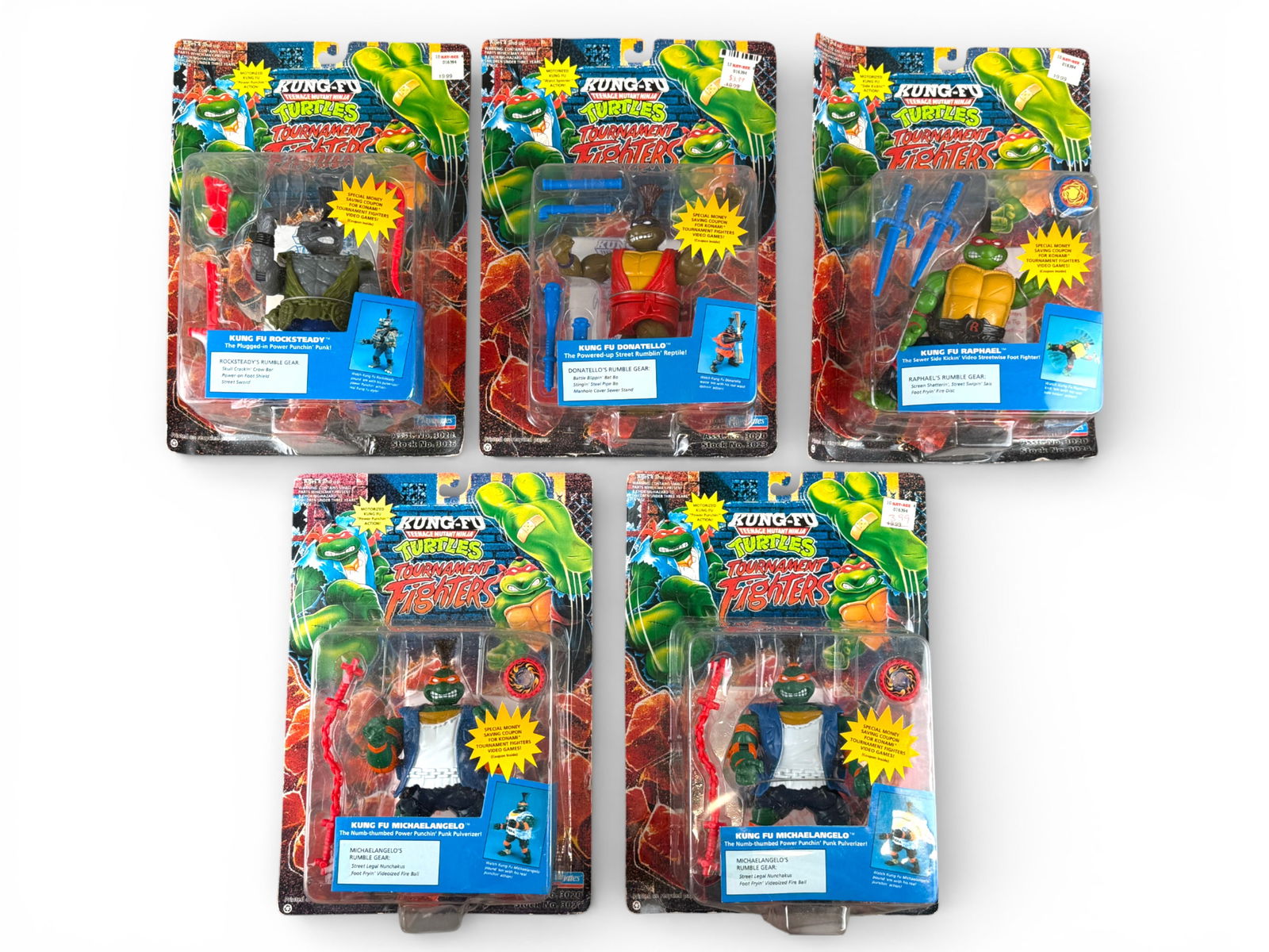 (5) TMNT Kung Fu Tournament Fighters - Playmates: Group of five Teenage Mutant Ninja Turtles Kung Fu Tournament Fighters by Playmates, 1994, including Raphael, Donatello, Michelangelo (2), and Rocksteady. Each sealed on original card with bright