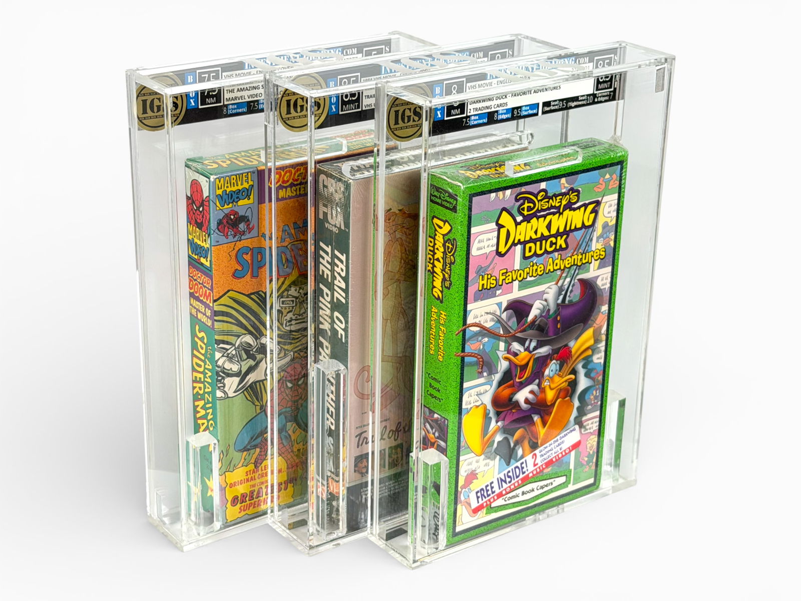 (3) Graded VHS: Spider-Man, Pink Panther, Duck: Three graded VHS movies including The Amazing Spider-Man - Doctor Doom (Marvel Video #1101, IGS graded Box 7.5 NM / Seal 5 VG, Cert #2247077), Trail of the Pink Panther (1984 CBS/Fox Video, IGS