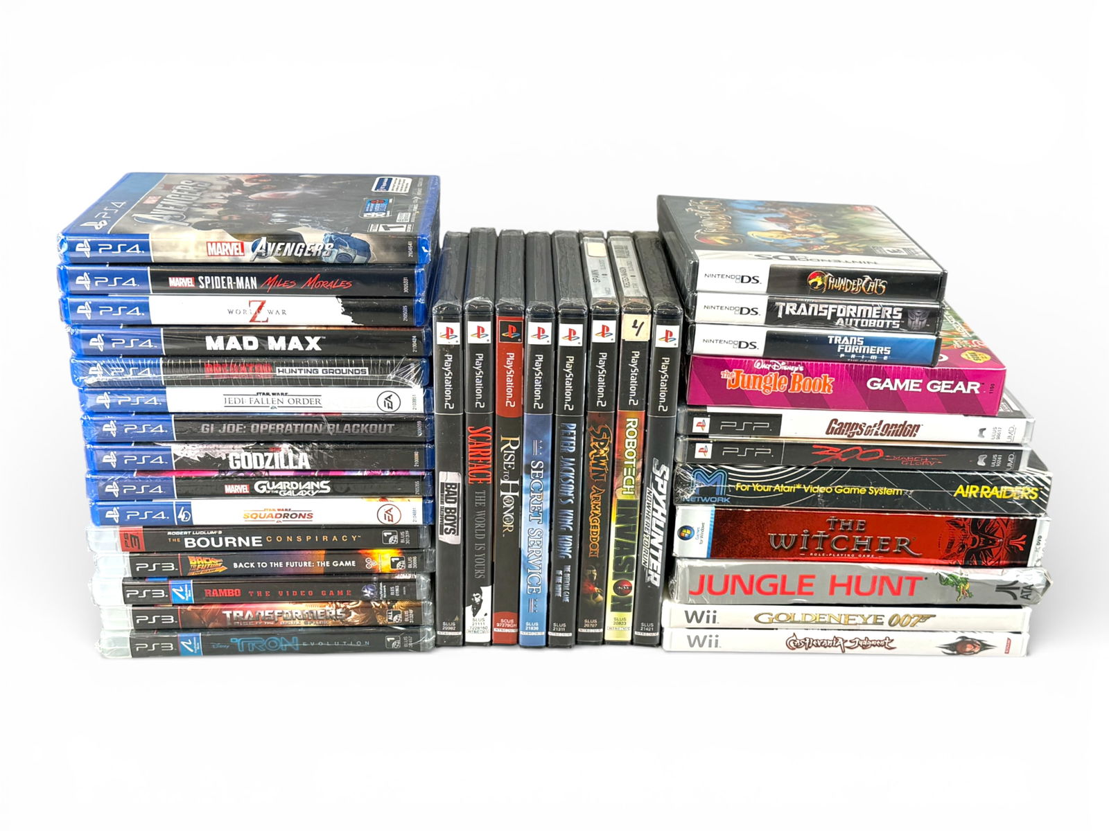 (34) Video Games - Mixed Systems, Mostly PlayStation: Large lot of thirty-four video games across multiple systems, primarily PlayStation. Titles include The Witcher, Godzilla, Marvel's Spider-Man: Miles Morales, Marvel Avengers, Mad Max, Star Wars Jedi: