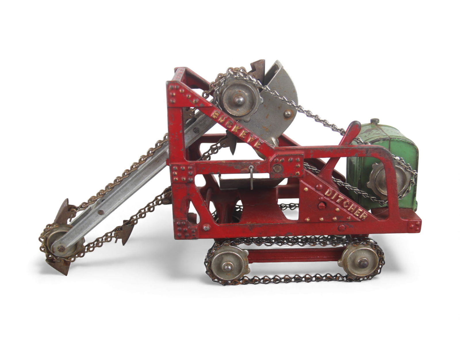 Scarce Kenton Buckeye Ditcher: Painted and nickel plated cast iron with steel chains 12" long. Crank digging action functions, elevator function missing cord. It retains 94% paint. Nice example. Shipping: Weiss Auctions offers full