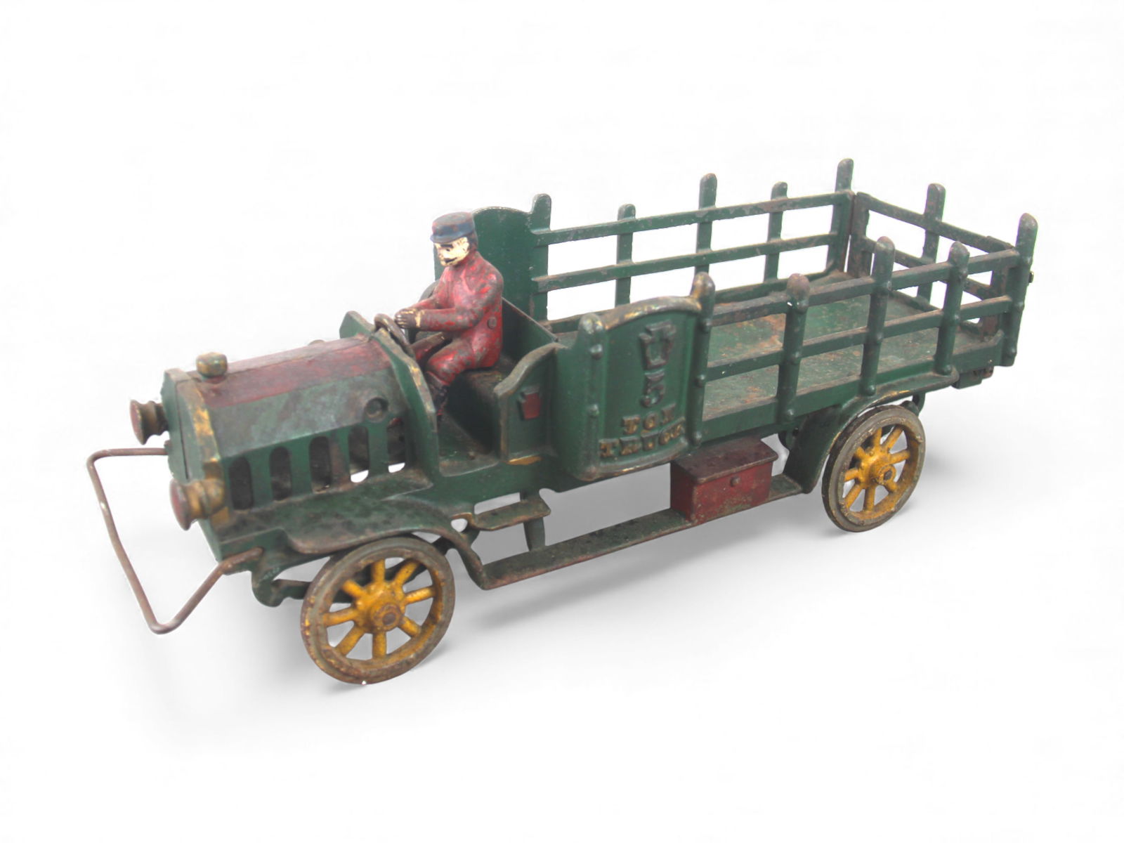 Large Hubley 5 Ton Stake Truck: Among the largest cast iron toys. It is painted cast iron with rubber wrapped iron spokes wheels(missing rubber), 17" long. It retains its original driver and front wire bumper. castings are intact ex