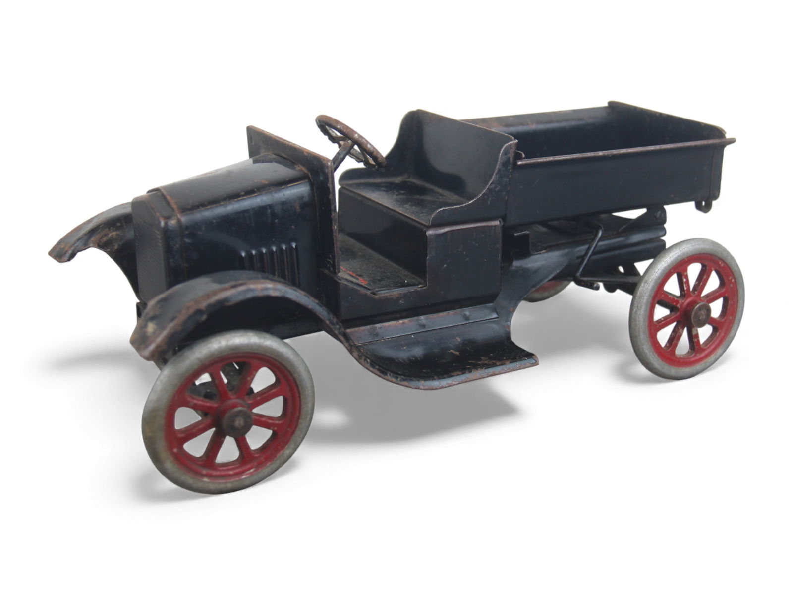 Buddy L Flivver Pick-up: Painted pressed steel with metal spoke wheels, 11" long. Decal fragment remains, steering functions and has nicer paint than usually seen on these, but Front wheel is loose, axel needs repair. Shippin