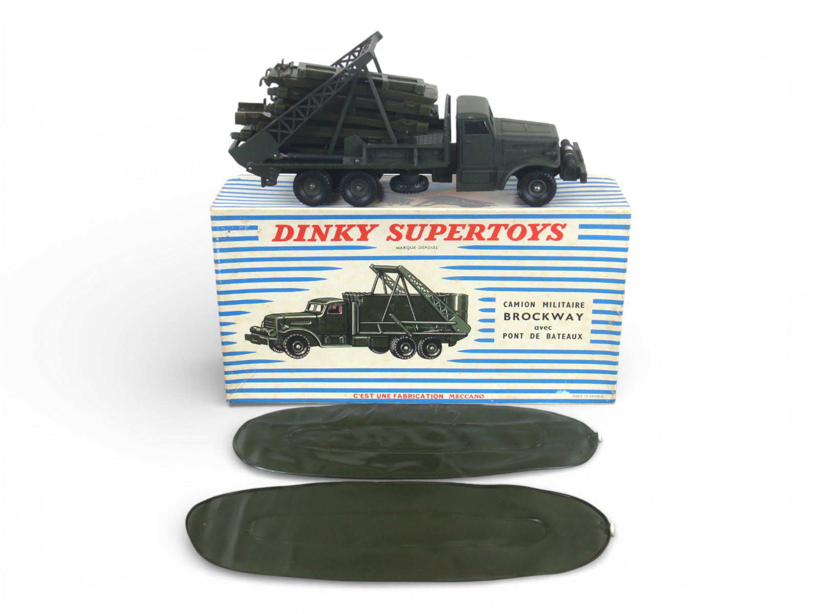 French Dinky 884 Brockway w/Boat Bridge: Includes an olive drab painted die cast truck about 1:43 scale. It has a framed platform containing 2 rafts and personnel walkway ramps. It is intact showing light handling with insert and nice box. 