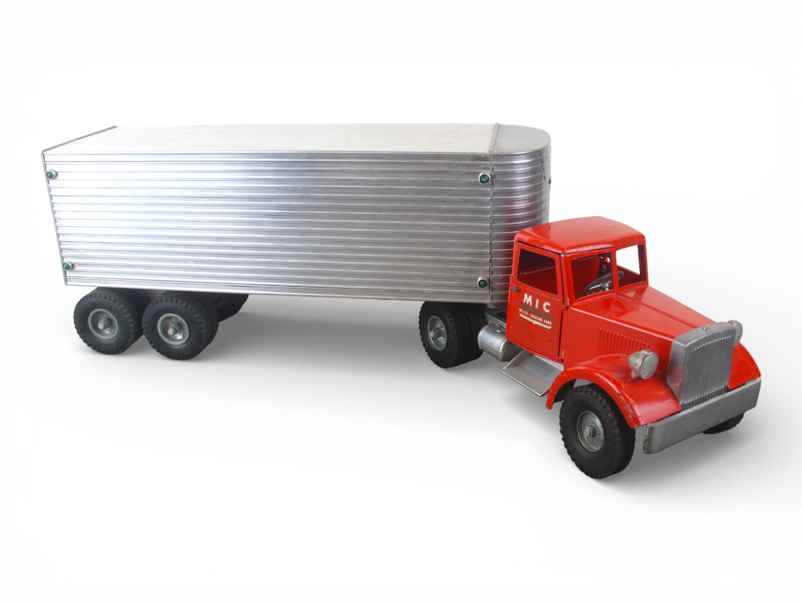 Smith-Miller B-Mack Freight Hauler: Painted die cast & aluminum with rubber tires, 27" over-all length. Nice MIC Mack Tractor with intact doors, working steering and nice decals; Fluted trailer embossed Freihof and has opening rear door