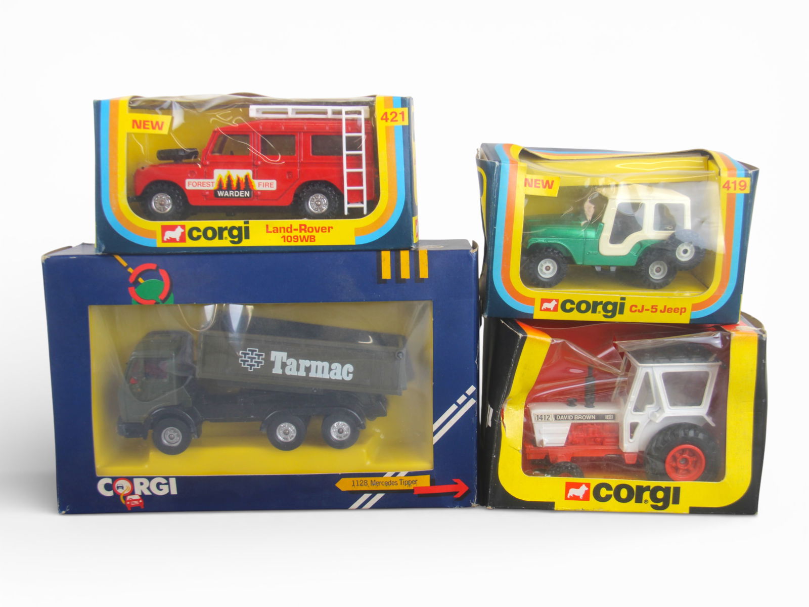 Boxed Corgi Diecast Vehicles: 4 boxed Corgi diecast vehicles including Nos. 55, 419, 421, and 1128. Some wear and some cello window separation. Shipping: Weiss Auctions offers full-service, in-house shipping for nearly all items