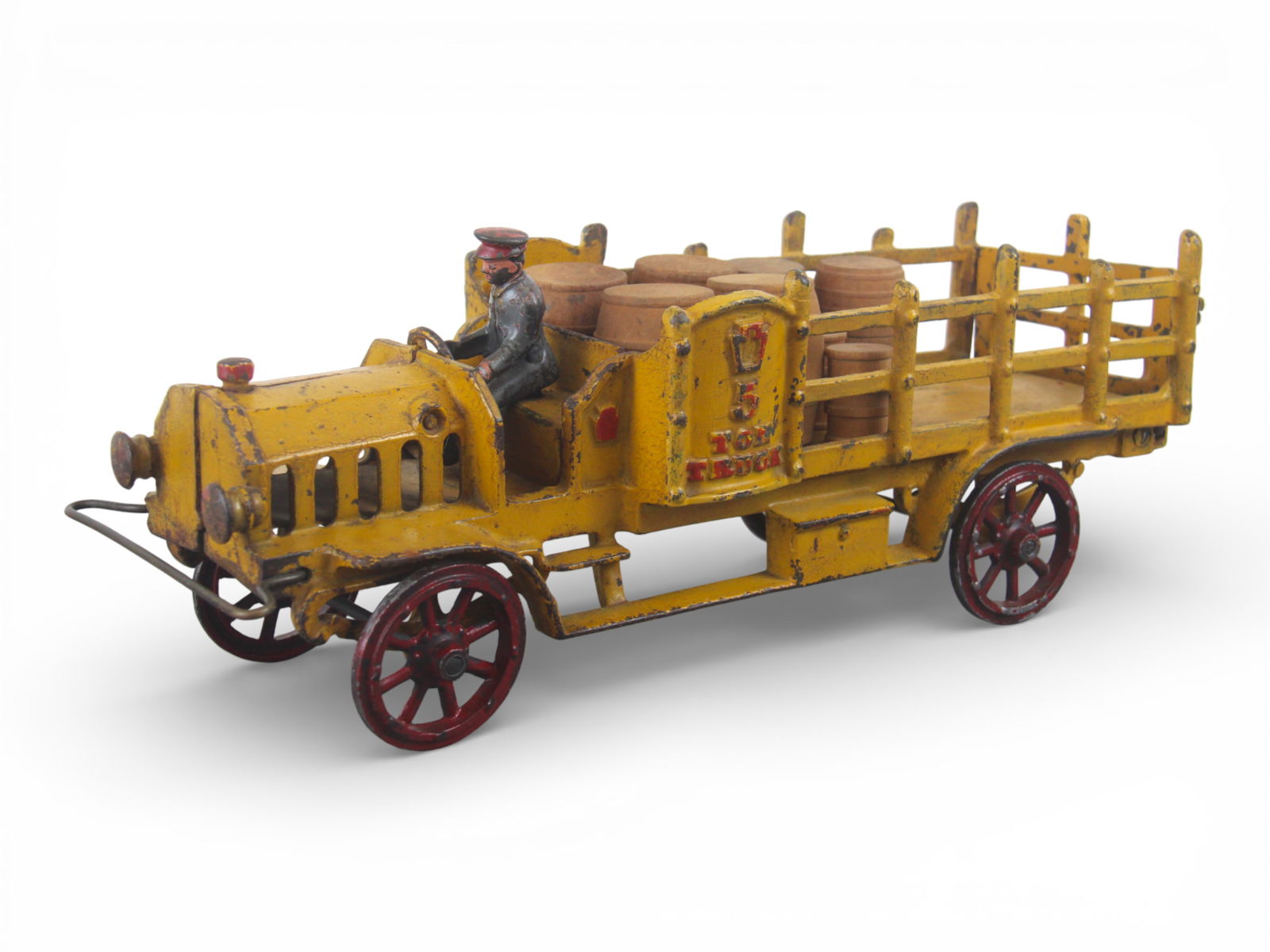 Large Hubley Cast Iron 5-Ton Truck: One of the nicer we have seen in a while! Painted cast iron with cast spoked hubs, missing the rubber wraps, 17" long. It has intact castings retaining its driver, front wire bumper and rear