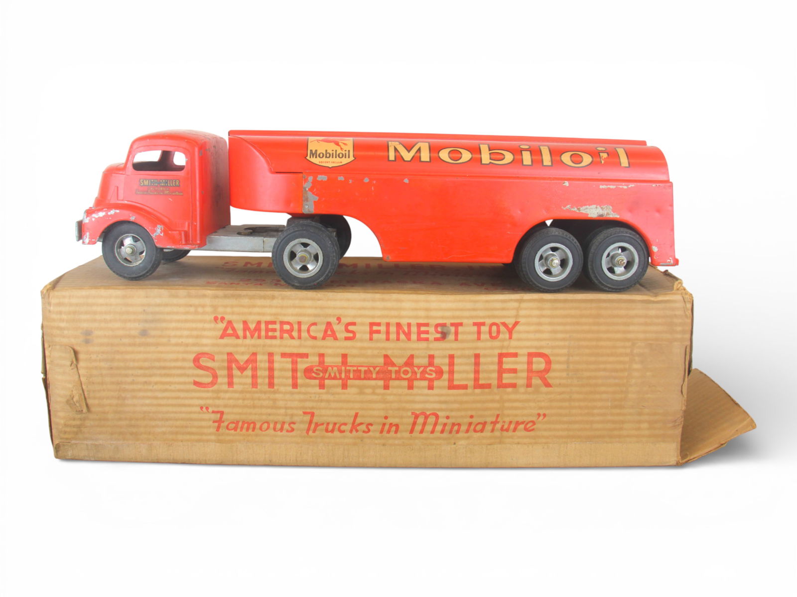 Boxed Smith-Miller 4990-6 Mobilgas Tanker: Painted die cast with rubber tires over cast hubs, 23" long. Decals are 100%, castings are intact. Toolbox door is there and paint would benefit from a clean and polish. It shows light play wear with