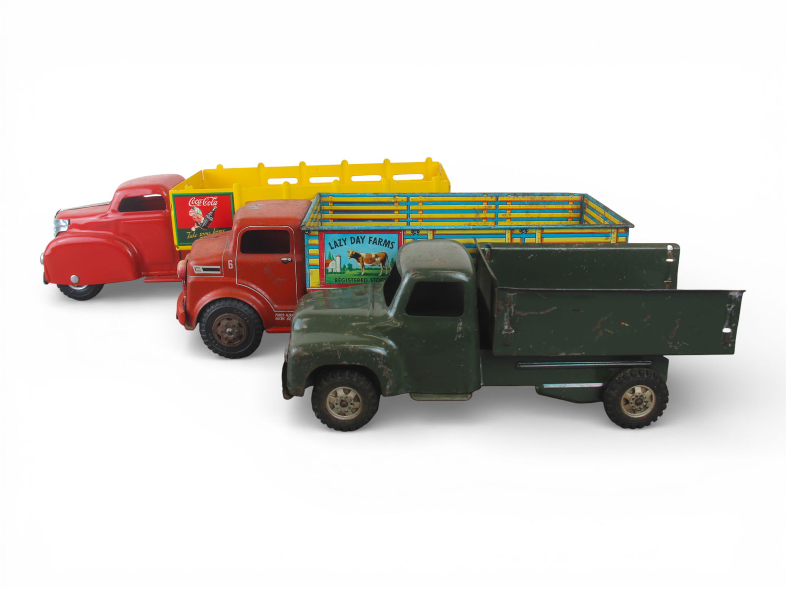 (3) Toy Trucks: Includes a restored Marx 21" Coca-Cola Truck, with modern accessories inside; Buddy L Army Truck, incomplete; Marx Farm Truck, both showing moderate play wear. Shipping: Weiss Auctions offers full-ser