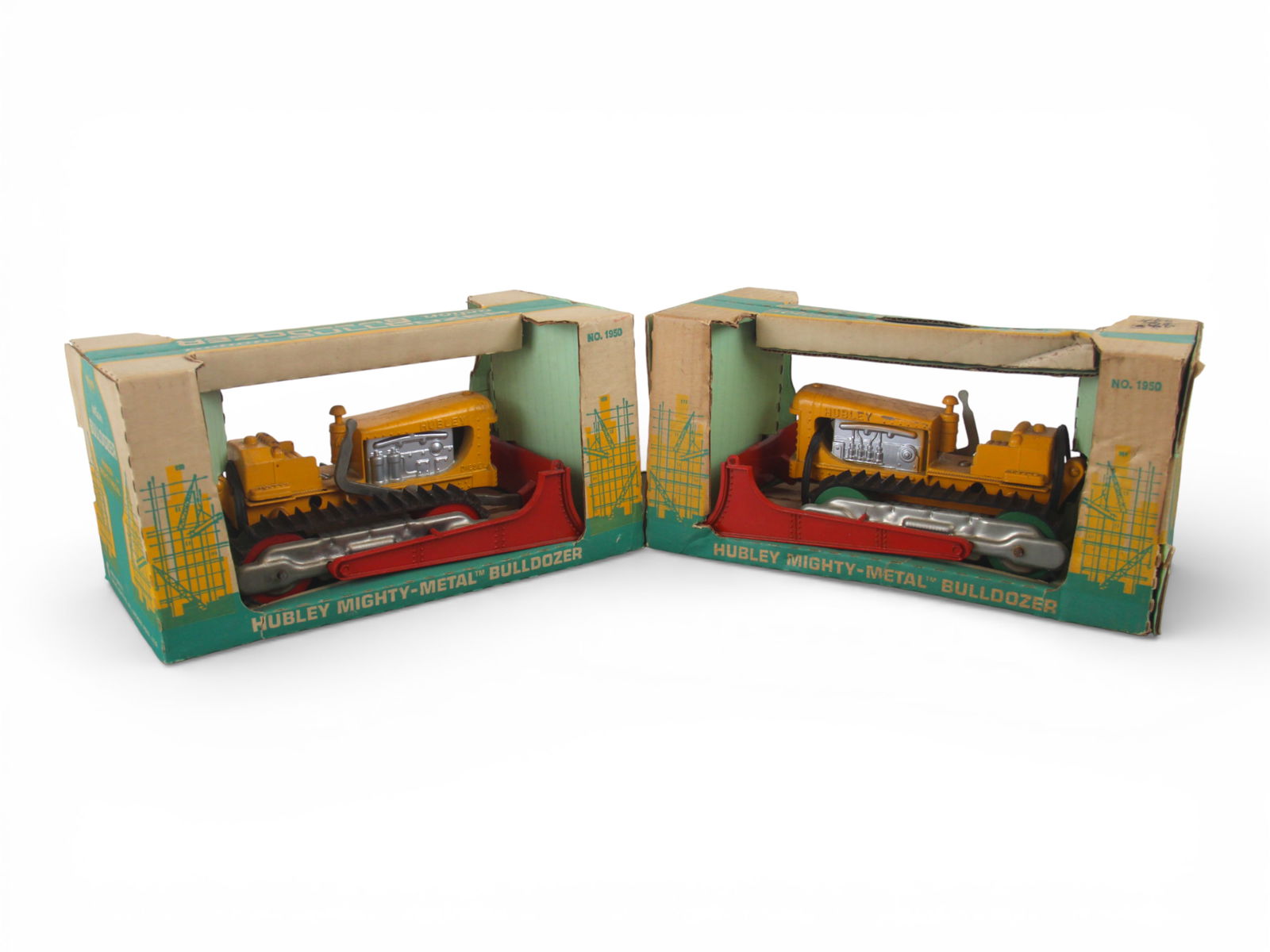 (2) Boxed Hubley 1950 Bulldozers: Painted die cast, each 90" long with rubber tracks. Both appear unplayed with strapped into packaging, but both would benefit from a cleaning. One shows some minor paint chips, boxed are better than