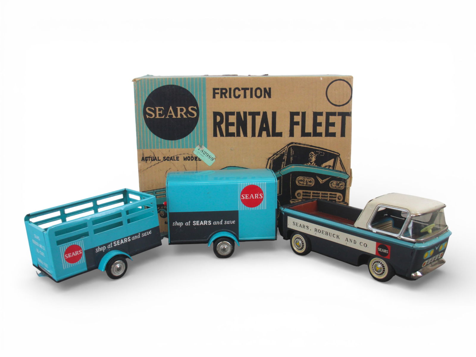 LN Boxed Sears Rental Fleet: Japan made litho tin, Ford Econoline style Pick-up with functional friction motor. It has a matching Open and box trailer. All appear new in nice box, no inserts. Display over-all 27" long. Super