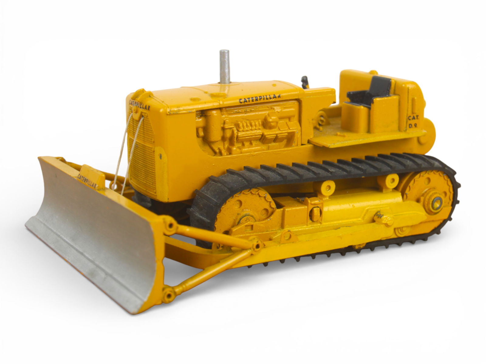 RARE Boxed Spot-On Caterpillar Dozer: Painted die cast with rubber tracks, about 1:43 scale. It has control lever action blade lift. It has some shelf dust but only minor signs of wear. It has both inserts and a lightly worn, but bright