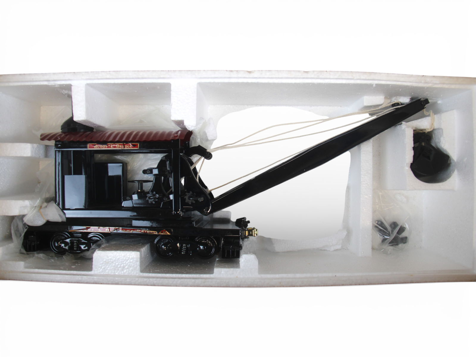 T-Repro Buddy L Railroad Dredge: Like new in opened box, but decals have curled and lifted. Heavy large box. Call for shipping quote!From the Gary Slutzky Collection of Pressed Steel, Tin, and Cast Iron Vehicles. Shipping: Weiss