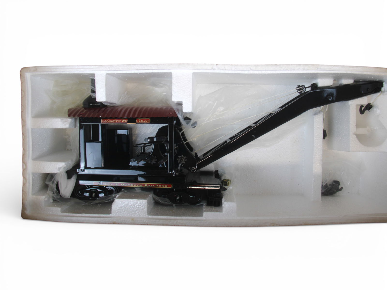 T-Repro Buddy L Railroad Crane: Factory new in opened boxes, but some decals have lifted and flaked. Heavy large box. Call for shipping quote!From the Gary Slutzky Collection of Pressed Steel, Tin, and Cast Iron Vehicles. 