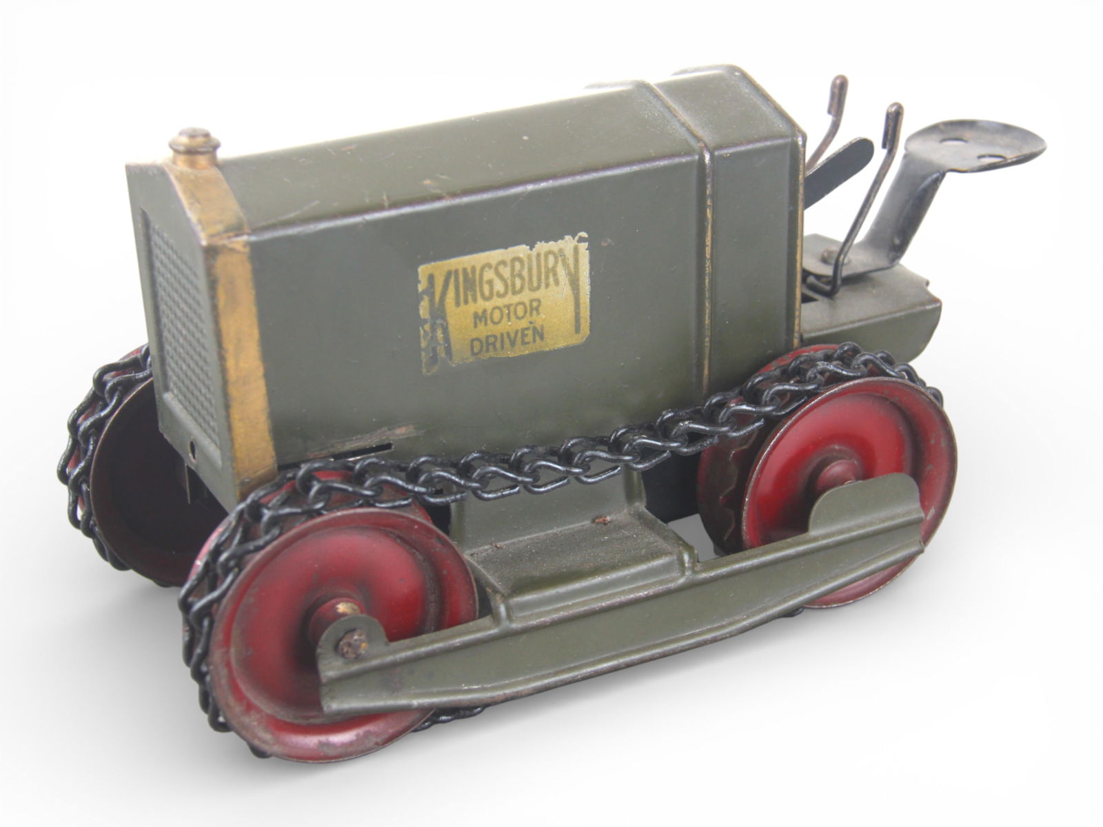 Keystone Motor Driven Tractor: Painted pressed steel with steel hubs with chain tracks, 8 1/2" long. Its in nice condition with 99% decals. Mechanism functions as enough wind left in to demonstrate, but needs a screw in key. It is
