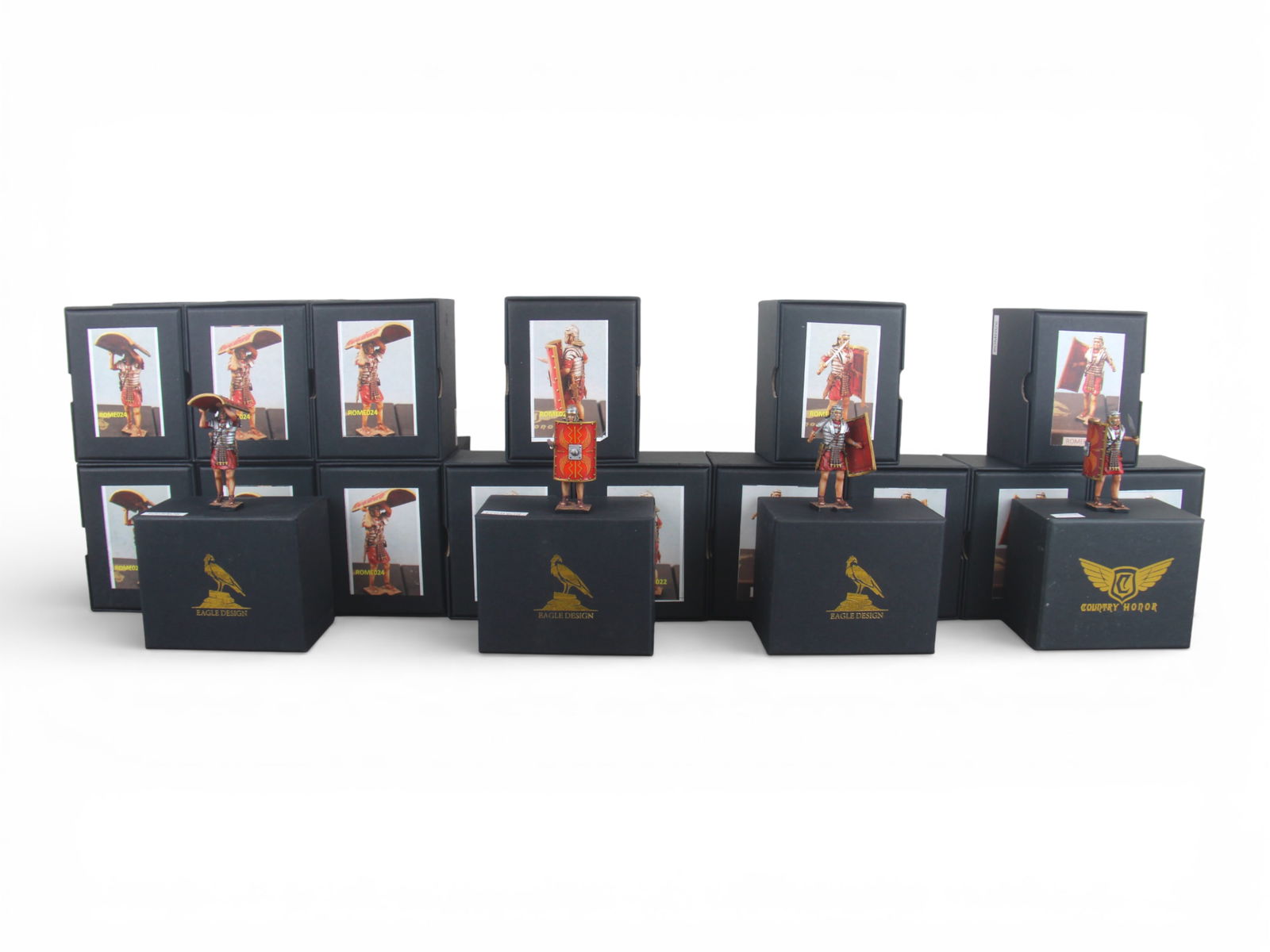 Eagle Design Roman Testudo Boxed Figures: 24 Eagle Designs Boxed Roman Legionnaires for a Testudo formation. Full set of 4 #22, 3 #23, 12 #24, 1 #25, 3 #26, and 1 #27. Excellent detail. Shipping: Weiss Auctions offers full-service, in-house s