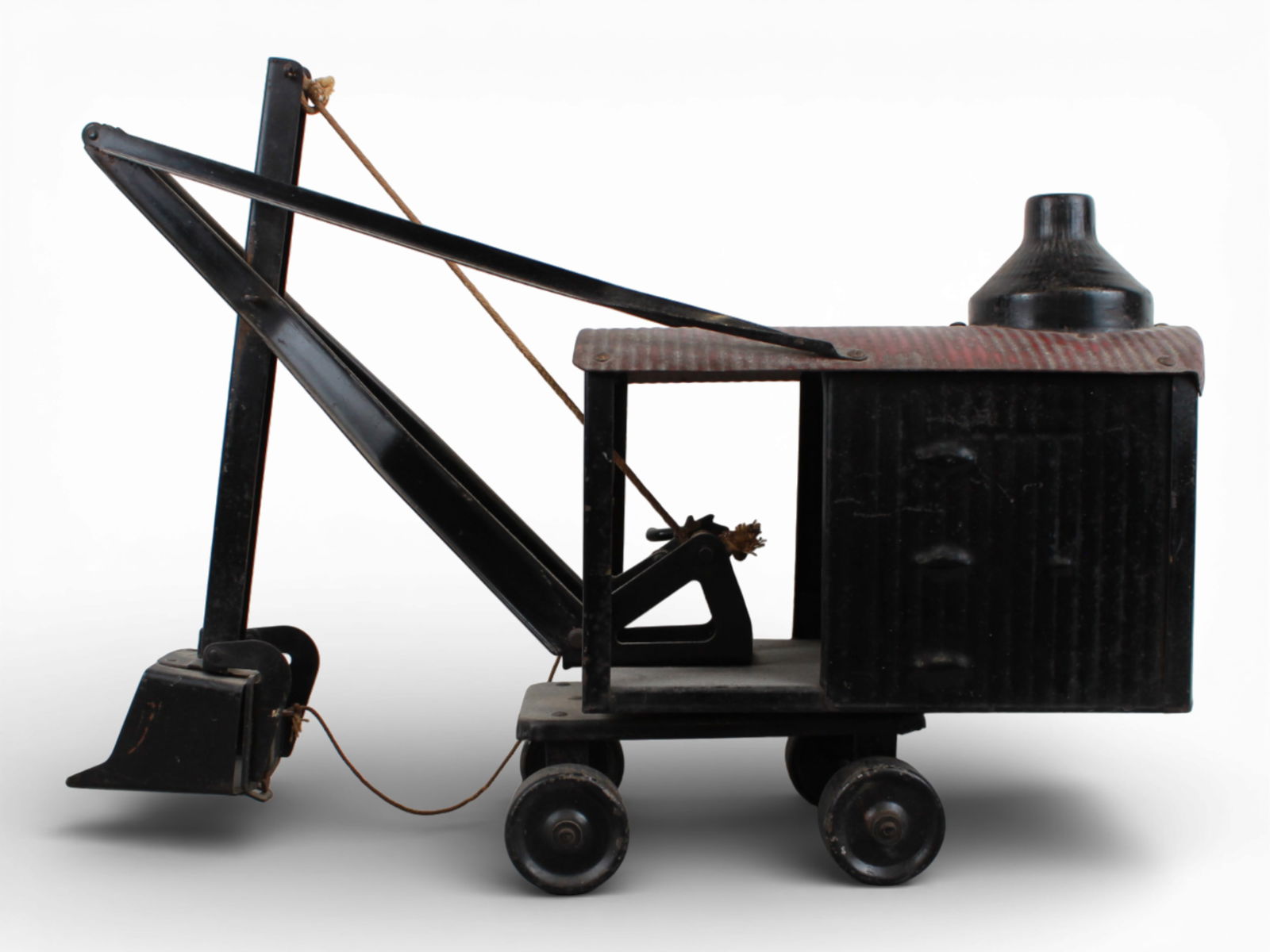Steal Craft Marion Steam Shovel: Painted pressed steel, 21" long. It retains its rear decal, top decal 85%. It would benefit from a cleaning and shows moderate play wear.From the Gary Slutzky Collection of Pressed Steel, Tin, and