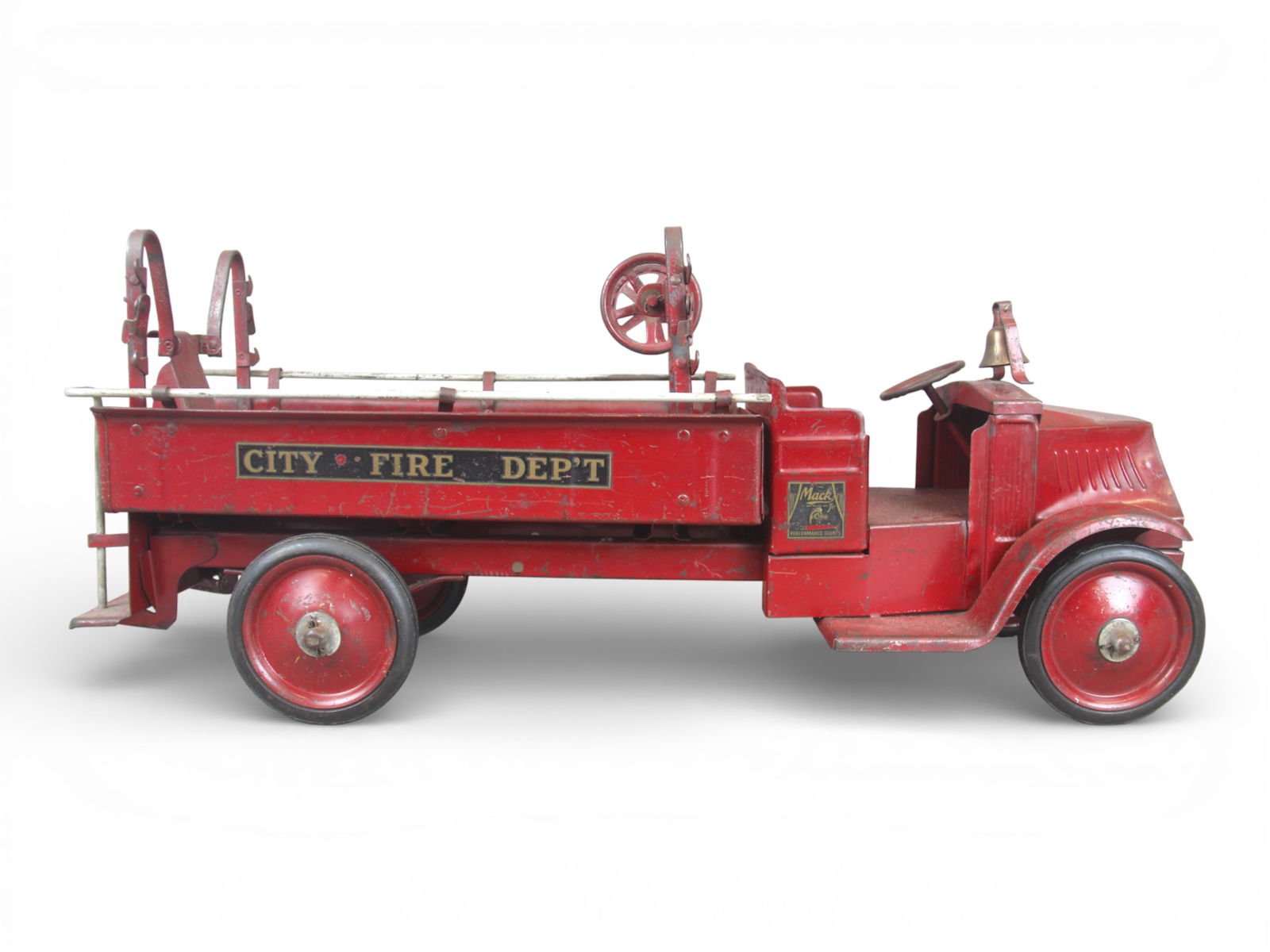 Steel Craft Hose & Ladder Fire Truck: Painted pressed steel with rubber wrapped steel hubs with Bulldog Mack front. It appears all original retailing its main crack-up ladder & bell, missing ladders and hose. It has 90% decals intact,
