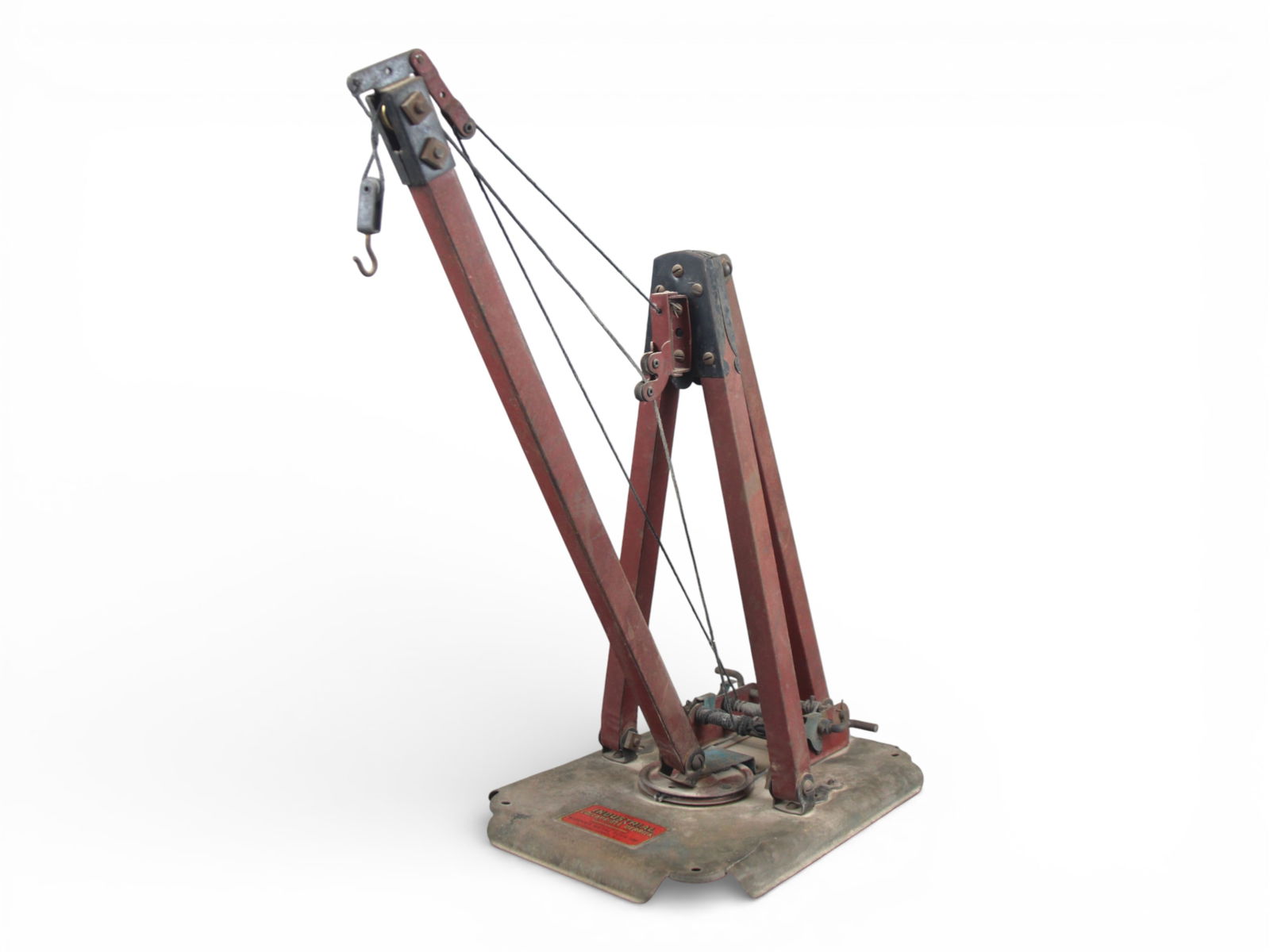 Kiddies Metal Toys Samson Industrial Derrick: Painted pressed steel on cast iron base, 16" tall. It is fully rigged and functional and would benefit from a cleaning. It has nice decals and shows moderate play wear.From the Gary Slutzky