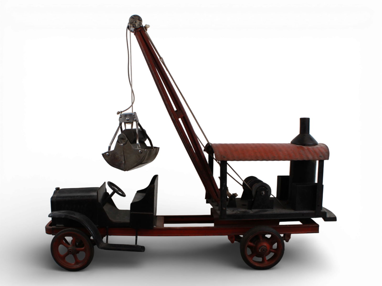 Kelmet Big Boy White Mobile Steam Shovel: Painted pressed steel with rubber wrapped cast spoked hubs, 25" long. It appears intact, front black parts have some over-painting, restrung. It shows moderate play wear. Scarce Toy!From the Gary