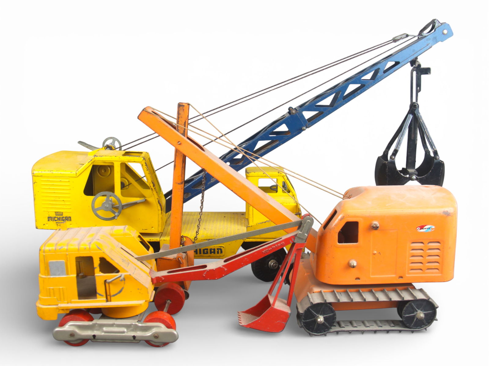 (3) Vintage Trucks: Includes a 1955 Ny-Lint Mobile Crane Shovel; 1964 Structo Steam Shovel, dusty; Hubley Die Cast Steam Shovel. missing tracks, dusty. All show light to moderate play wear.From the Gary Slutzky