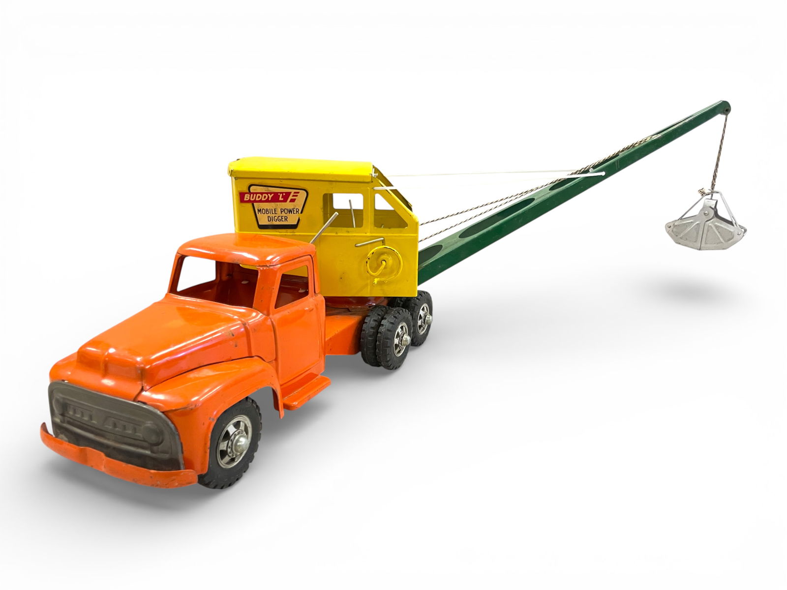 1958 Buddy L Large Mobile Clam: Painted Pressed steel with rubber tires, 18" long, +Boom. It has its line, but not strung correctly with the original clam scoop, missing boom support wire. It has nice decals and shows light play