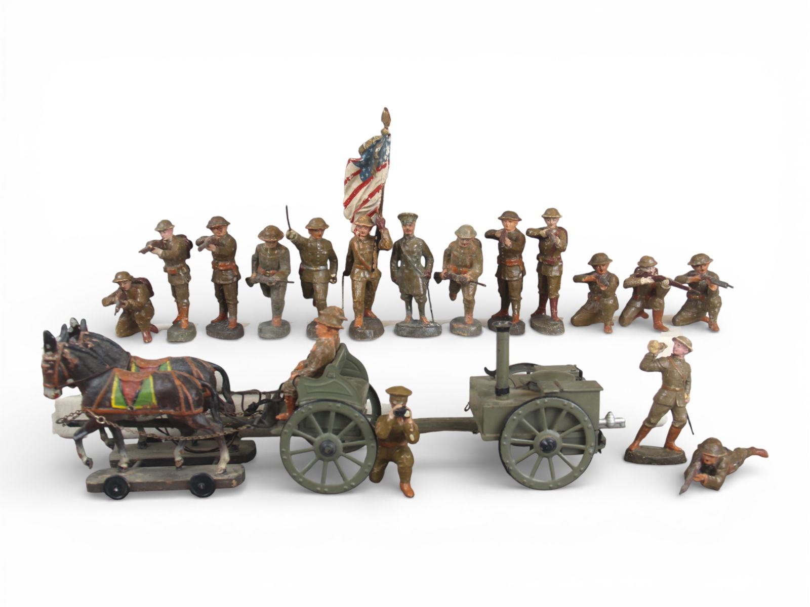 Elastolin 105mm Scale U.S. WWI Soldiers: Elastolin 105mm scale U.S. WWI or interwar soldiers; 18 pieces. Includes infantry and cook wagon with horses and attendants. Some wear. Shipping: Weiss Auctions offers full-service, in-house