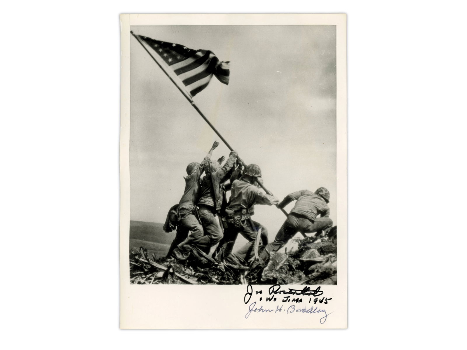 Joe Rosenthal Iwo Jima Photo, Signed: Iconic photograph depicting six United States Marines raising the U.S. flag atop Mount Suribachi during the Battle of Iwo Jima. The image is signed in ink by photographer Joe Rosenthal and