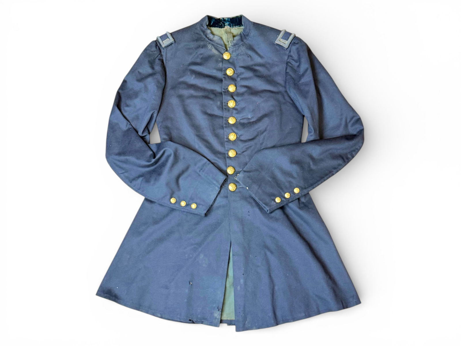 Civil War Union Coat and Sash: Civil War Union Infantry First Lieutenant's Frock Coat (with shoulder boards) Rare Chasseurs Cape, and Red Officers Sash. Coat and cape have infantry buttons. Not identified.Shipping: Weiss Auctions
