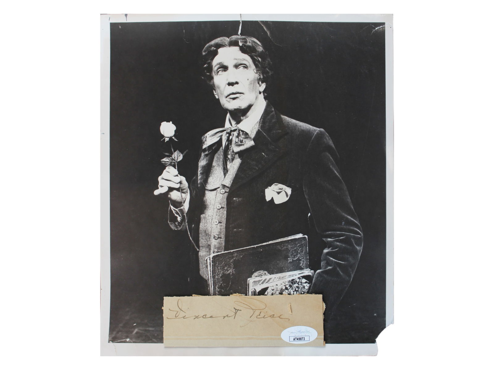 Vincent Price Signed Cut - JSA: Signed cut by Vincent Price, measuring approximately 4.25" x 1.5". Accompanied by a photograph of Price portraying Oscar Wilde on Broadway. Price remains one of the most recognizable figures in classi