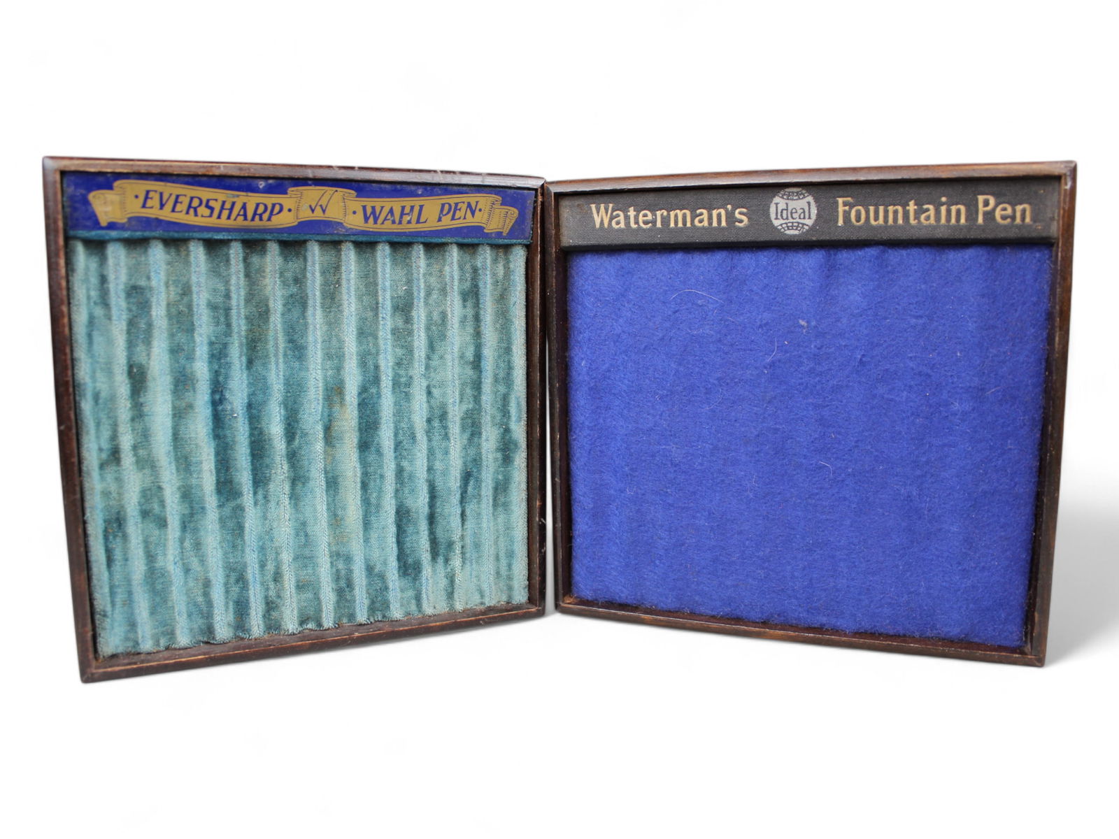 Waterman & Wahl Eversharp Fountain Pen Store Trays: 2 original vintage Fountain Pen store display trays Waterman's 10 slot and Eversharp Wahl 12 slots. Some wear. Waterman appears to be replacement felt.Shipping: Weiss Auctions offers full-service,