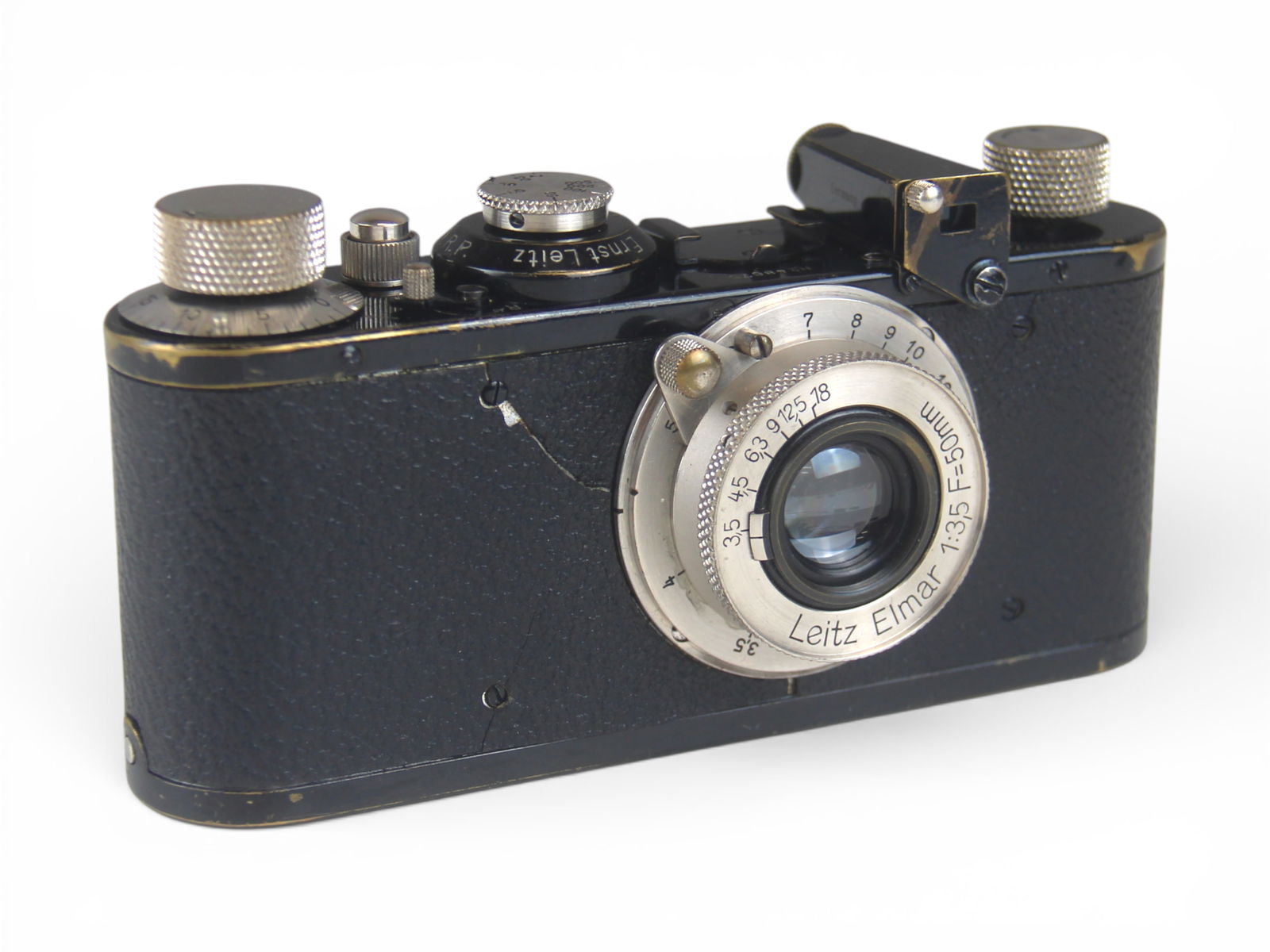 Leica I 1930 Camera & Elmar Lenz: Leica I Camera. Serial number 48675, ca. 1930. WIth Elmar 1:3.5 50mm lens. Some wear to paint and some cracking to covering. From single owner, lifetime Leica and photographica collection. Shipping: W