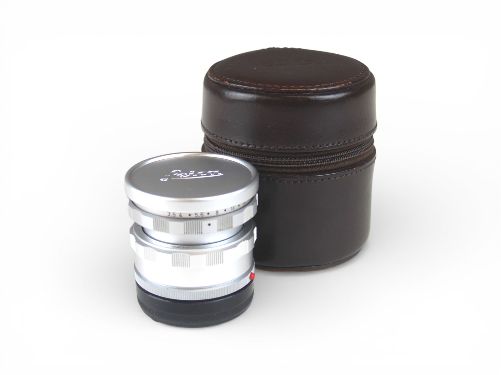 Leica Leitz Elmar 3.5/65 Lens: Leitz Elmar 3.5/65 Lens, serial number 2016243. Canadian production. In Leitz New York brown leather case. From single owner, lifetime Leica and photographica collection. Shipping: Weiss Auctions offe