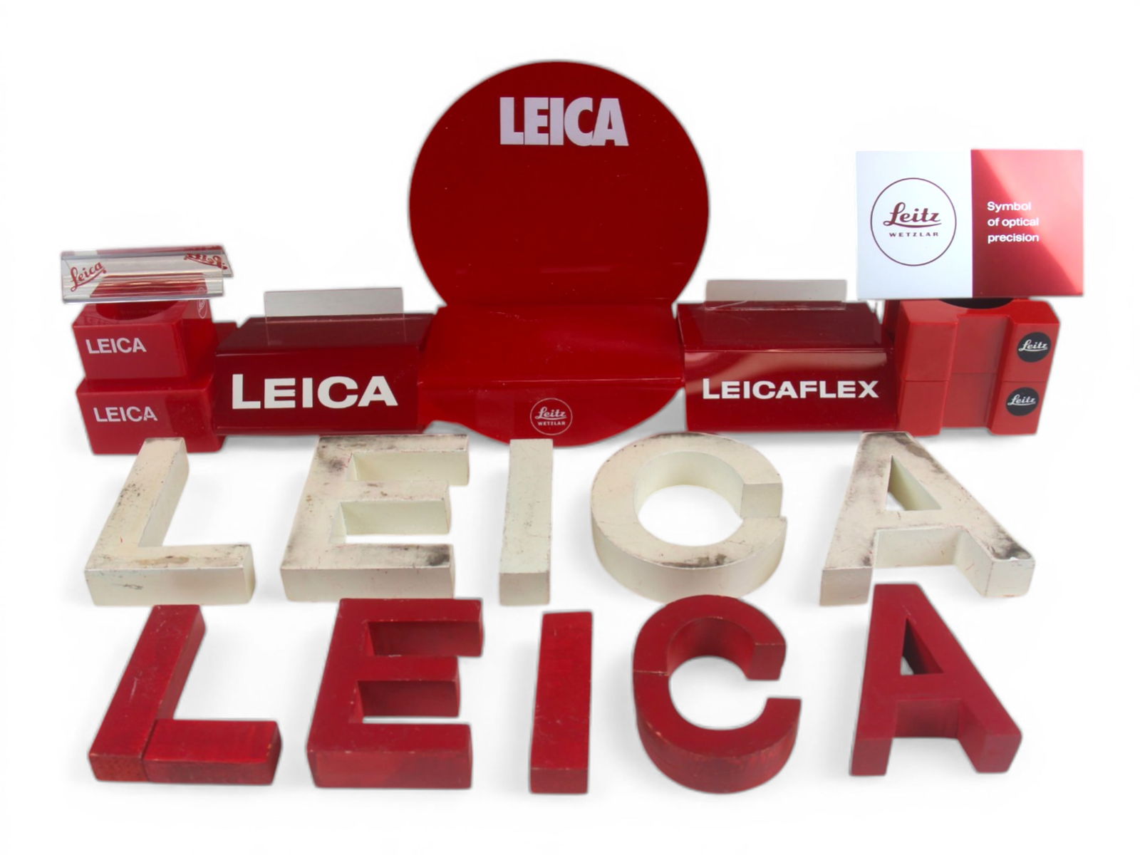 Leica Point of Sale Displays: Leica Point of Sale Displays including 7 item stands and 2 sets of wooden letters spelling Leica.From single owner, lifetime Leica and photographica collection.Shipping: Weiss Auctions offers