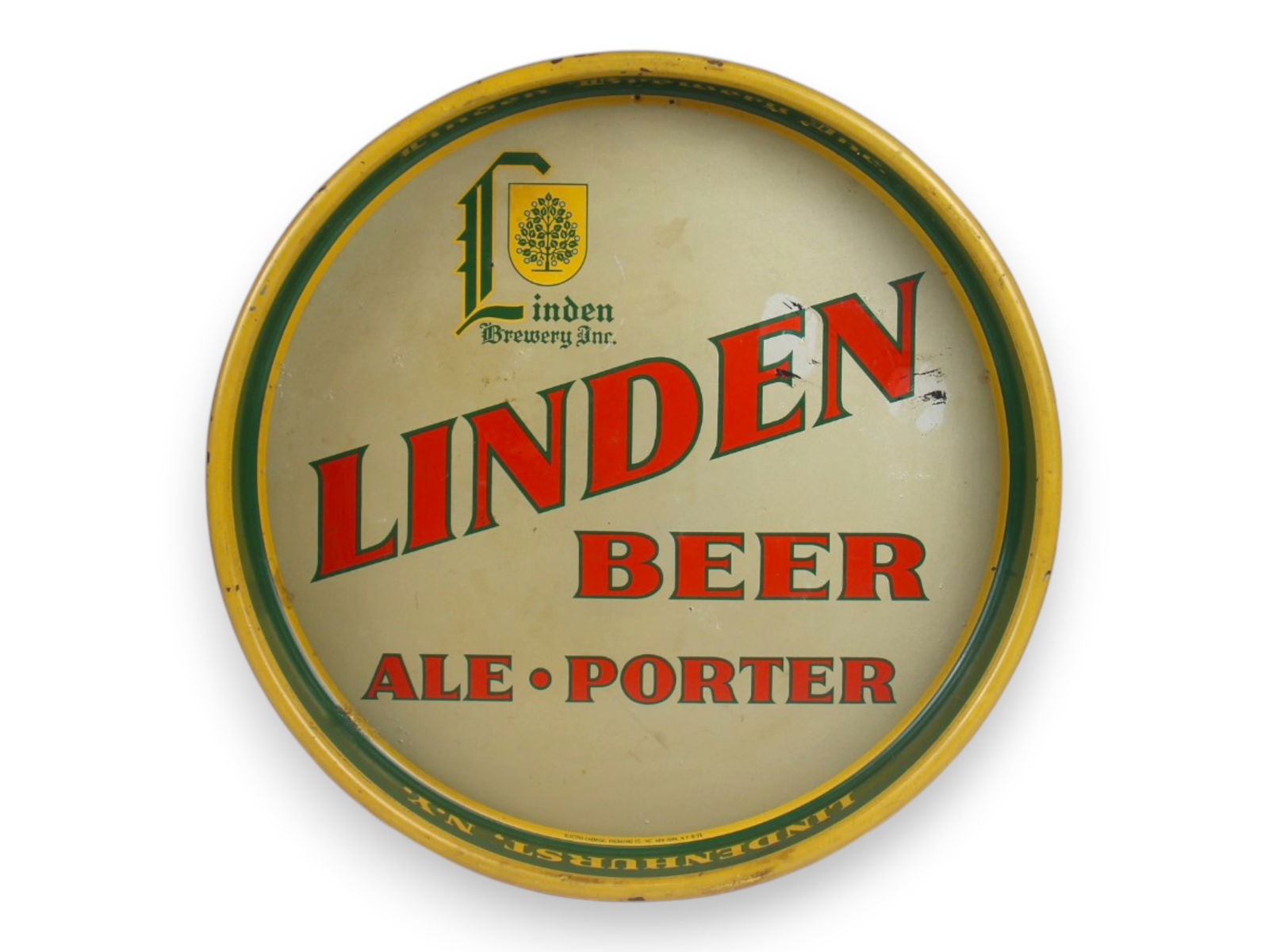 1937 Linden Beer-Ale-Porter Tray: 13" diameter with small nail hole in top margin and some wear and two faded spots.Shipping: Weiss Auctions offers full-service, in-house shipping for nearly all items in this auction. For a shipping