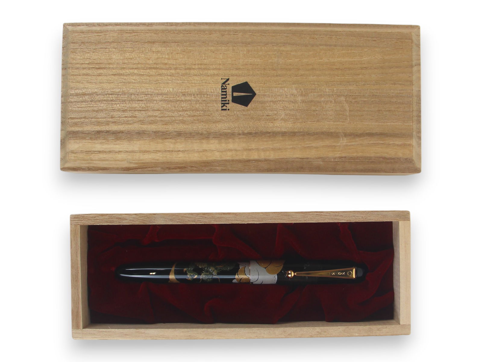 Namiki Maki-e Dragon Rollerball Pen in Box: Namiki Maki-e Dragon rollerball pen in original wood box. Minor wear, if any.Shipping: Weiss Auctions offers full-service, in-house shipping for nearly all items in this auction. For a shipping