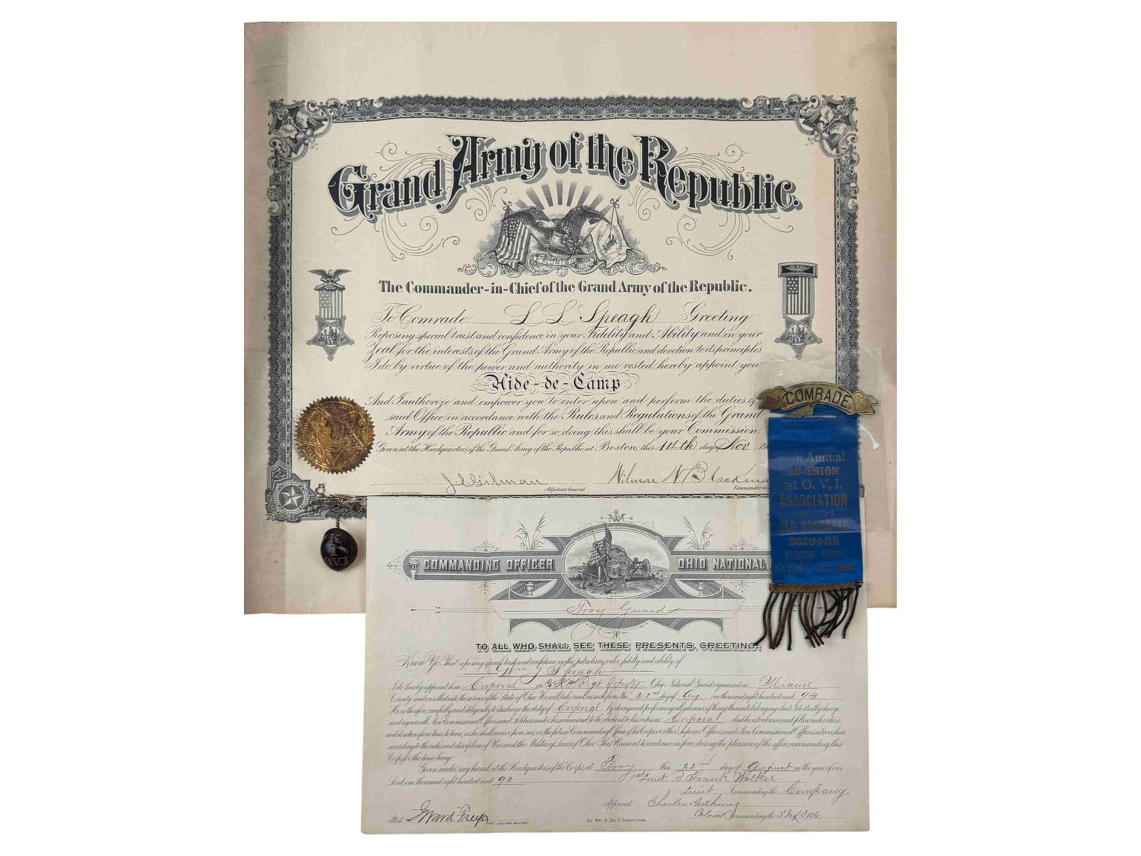 G.A.R. 1st Ohio volunteer grouping: Includes Infantry Ribbon, Document and Watch Fob.Shipping: Weiss Auctions offers full-service, in-house shipping for nearly all items in this auction. For a shipping quote, please contact us prior to